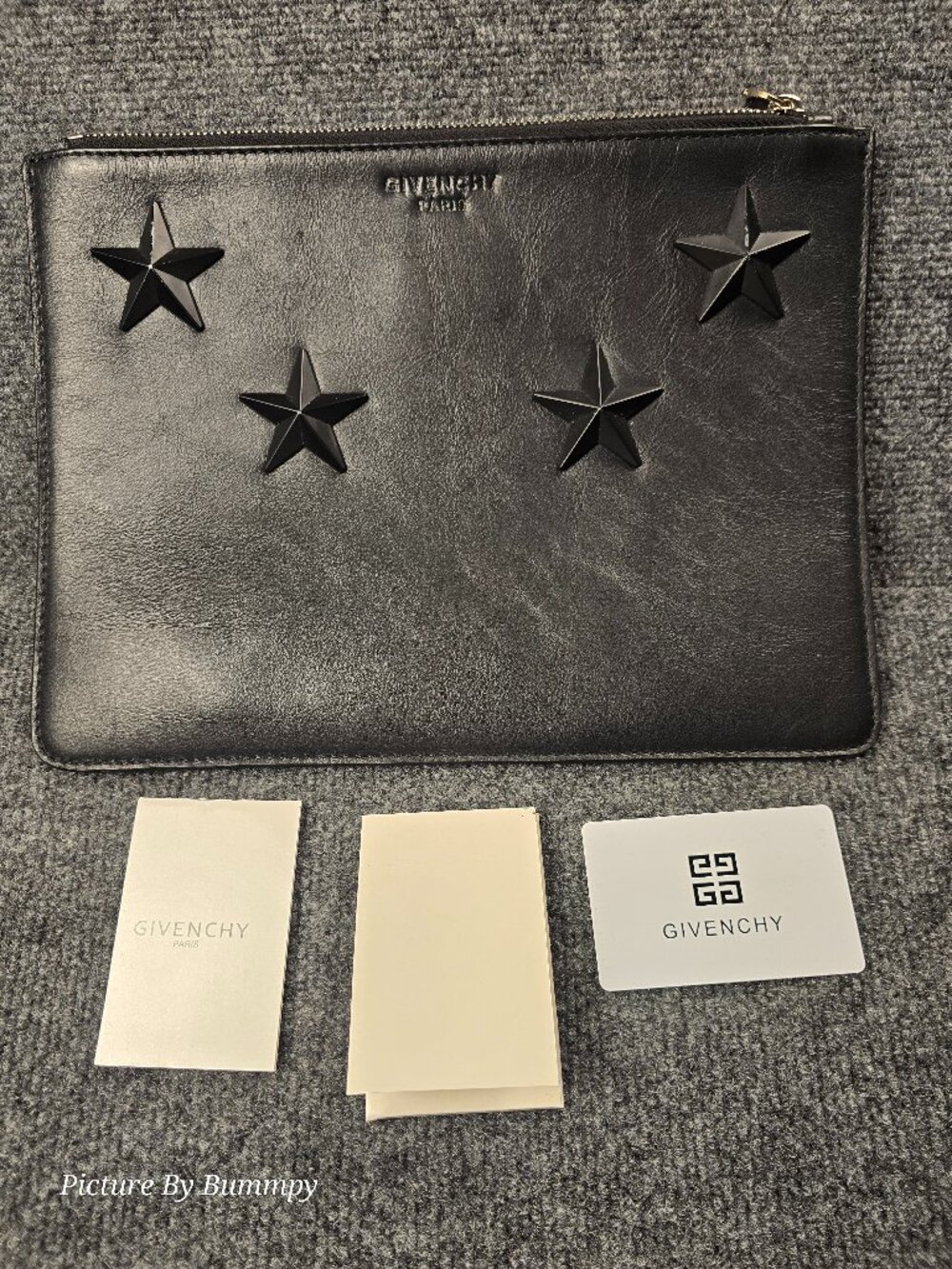 Authentic Givenchy Star Logo Leather Clutch Bag.